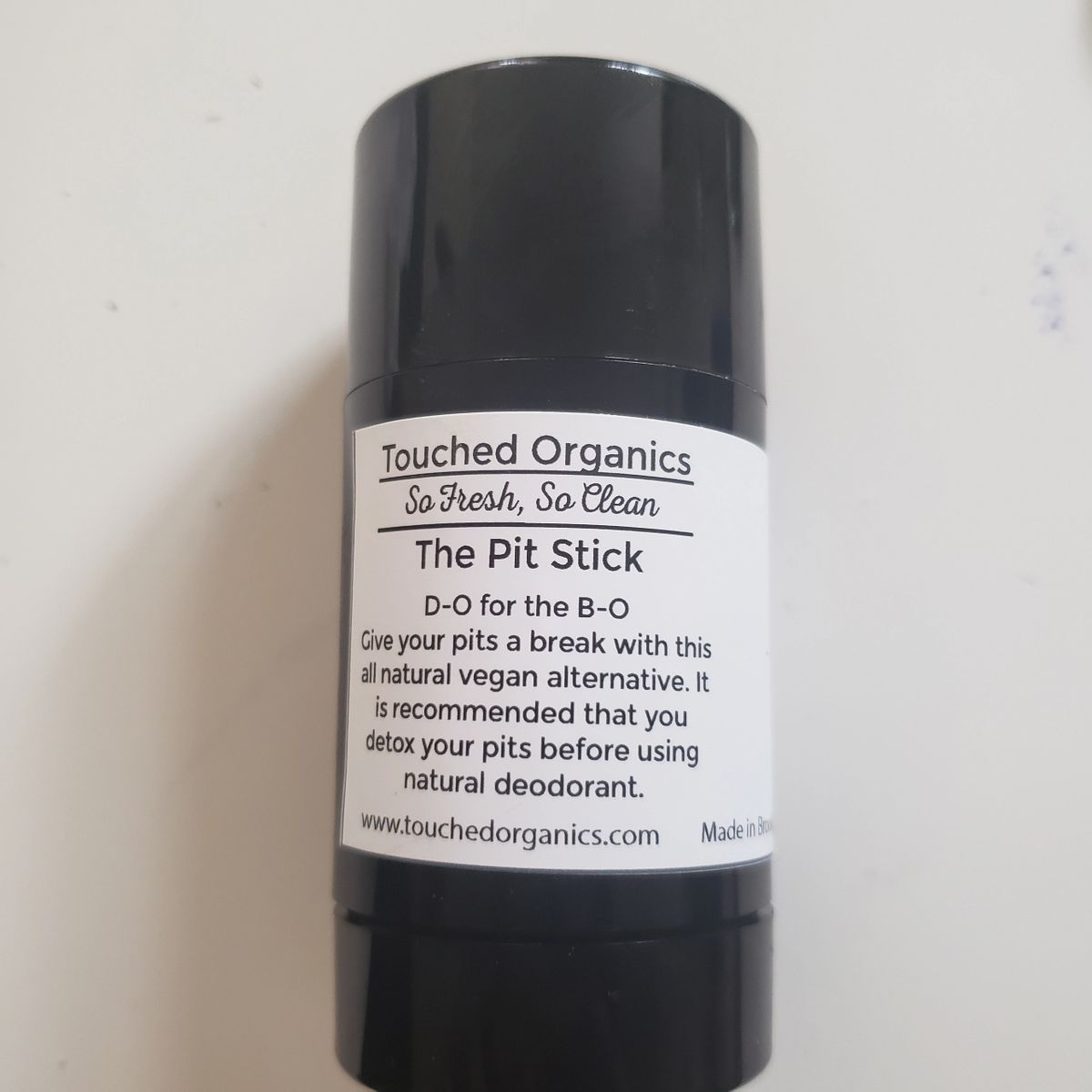 vegan and natural deodorant with the scent of lemon and tea tree oils. It's D-O for the B-O.